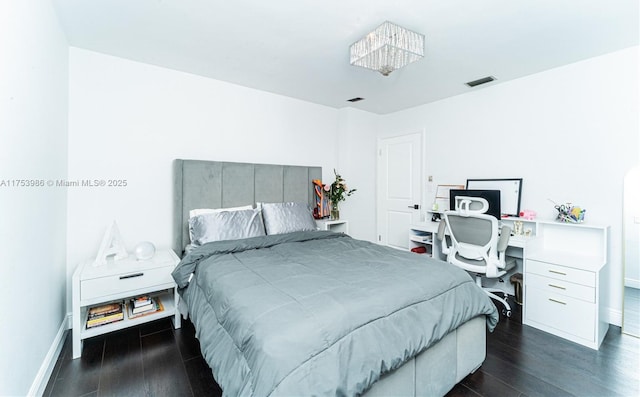 bedroom featuring dark wood-style floors, baseboards, and visible vents