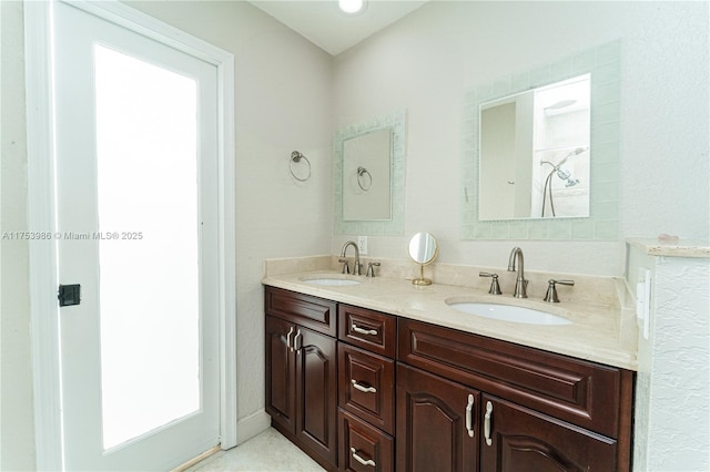 bathroom with a sink and double vanity