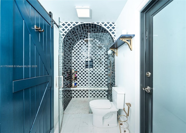 full bath featuring a stall shower, marble finish floor, and toilet