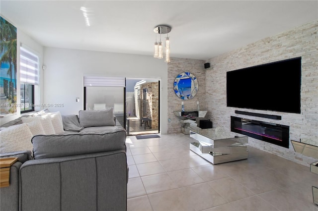 tiled living area with a glass covered fireplace