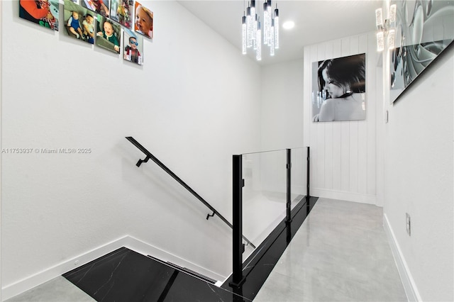 stairs with concrete flooring and baseboards