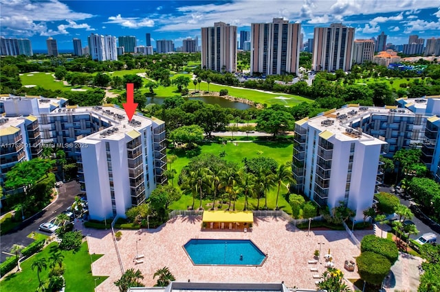 birds eye view of property with a view of city and a water view