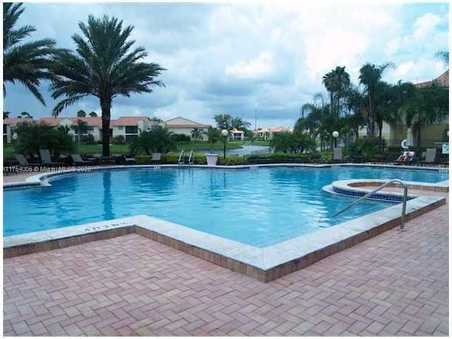 pool with a patio area