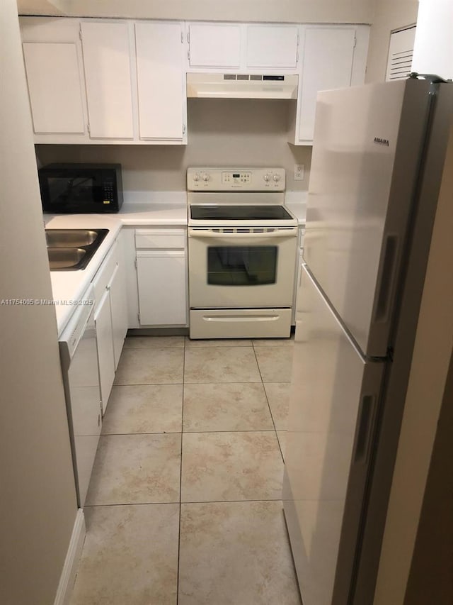 kitchen featuring under cabinet range hood, white appliances, a sink, white cabinetry, and light countertops