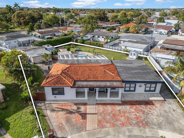 birds eye view of property with a residential view