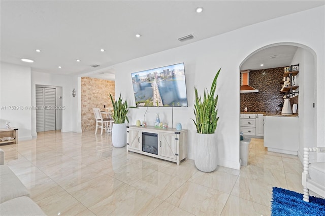 interior space with marble finish floor, baseboards, visible vents, and recessed lighting