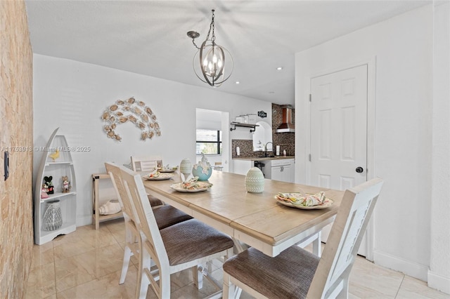 dining area featuring recessed lighting, baseboards, and an inviting chandelier