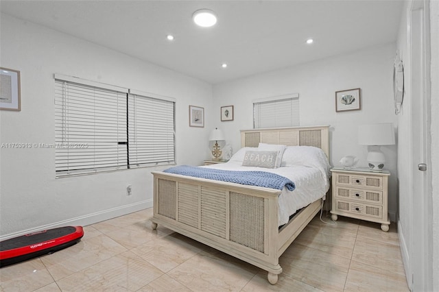 bedroom featuring baseboards and recessed lighting