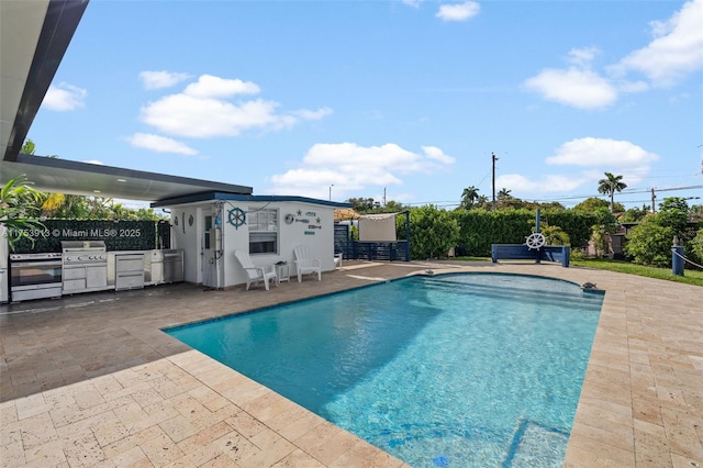 view of swimming pool with a patio, an outdoor structure, and a fenced in pool