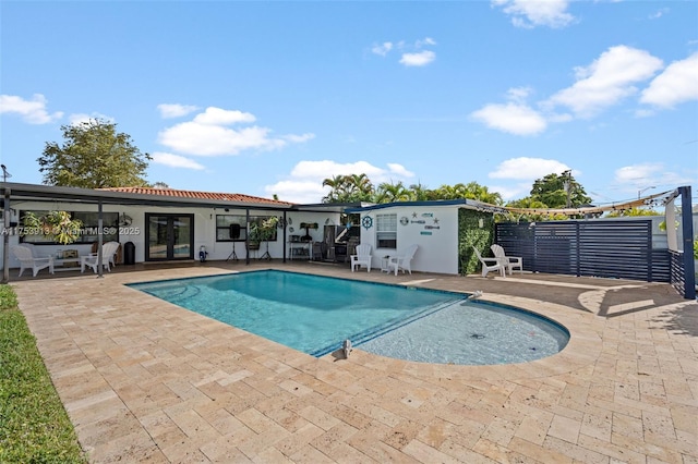 view of swimming pool featuring a patio area and a fenced in pool