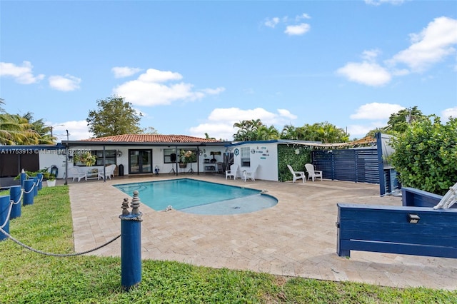 pool featuring french doors and a patio area