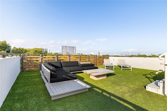 view of yard featuring a view of city and an outdoor living space