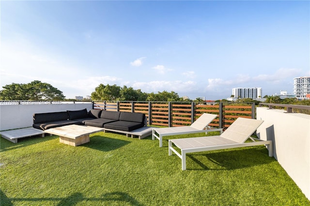 view of yard featuring a view of city and outdoor lounge area