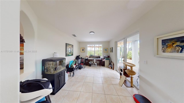 home office with light tile patterned floors and visible vents