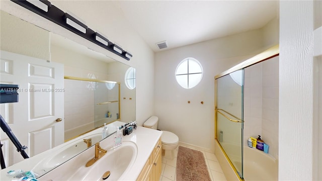 bathroom with tile patterned flooring, toilet, vanity, visible vents, and baseboards