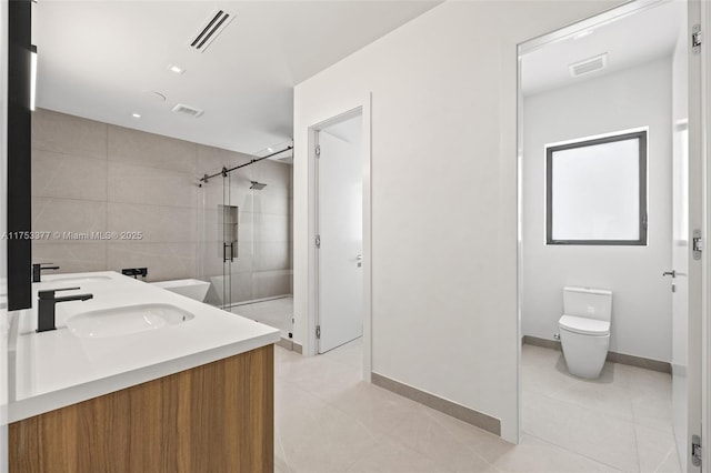 bathroom featuring toilet, a stall shower, visible vents, and a sink