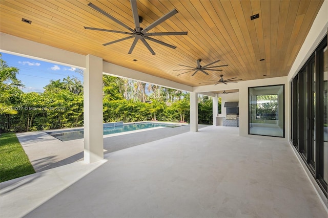 view of patio / terrace with an outdoor pool, ceiling fan, and an outdoor kitchen