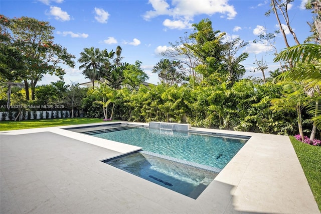 view of swimming pool with a pool with connected hot tub and a patio