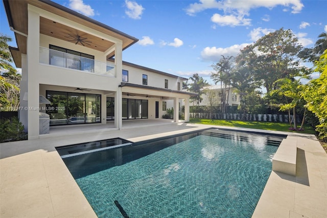 view of pool with a patio area, fence, a ceiling fan, and a fenced in pool