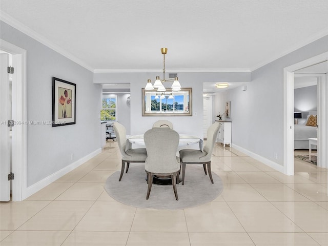 dining area with light tile patterned floors, ornamental molding, baseboards, and an inviting chandelier