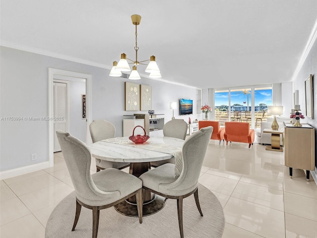 dining space featuring light tile patterned floors, ornamental molding, a chandelier, and baseboards