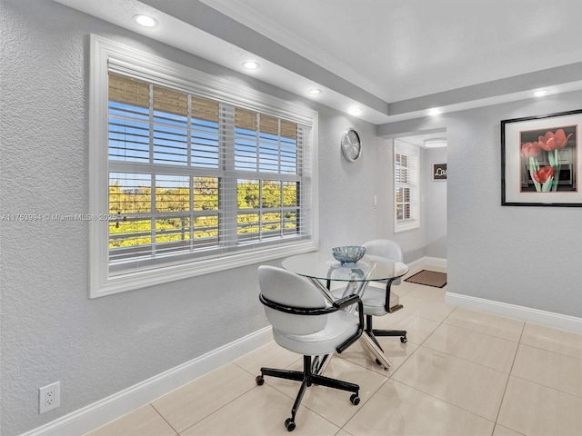 dining space with a textured wall, recessed lighting, tile patterned flooring, and baseboards