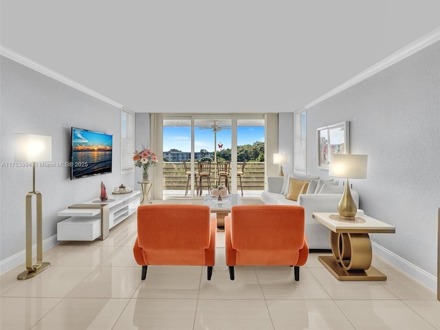 living room featuring light tile patterned floors, ornamental molding, a wall of windows, and baseboards