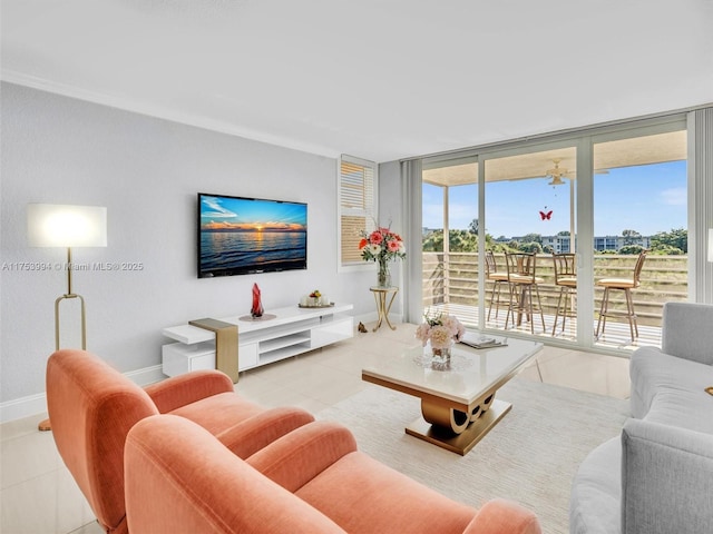 living room with light tile patterned floors, floor to ceiling windows, and baseboards