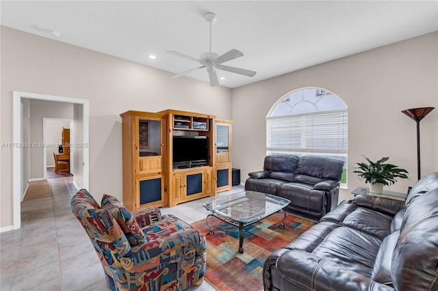 living area with a ceiling fan, recessed lighting, baseboards, and light tile patterned floors