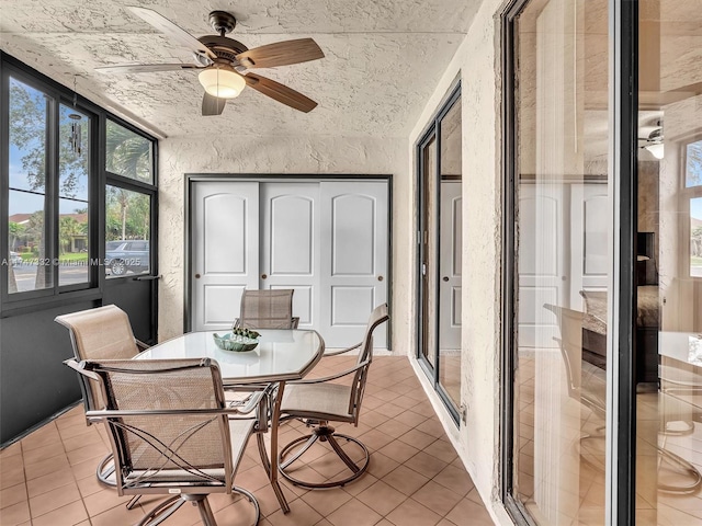 sunroom / solarium with ceiling fan