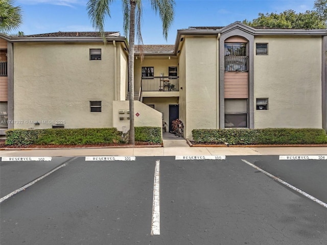 view of property with uncovered parking