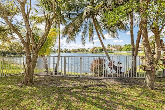 property view of water featuring fence