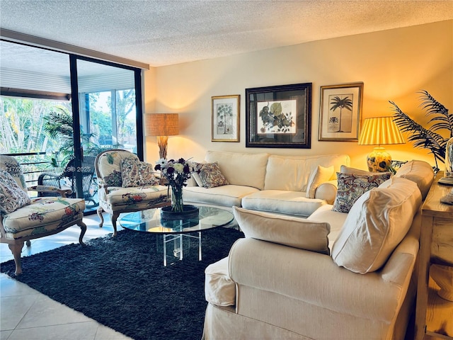 living room with expansive windows, a textured ceiling, and tile patterned floors