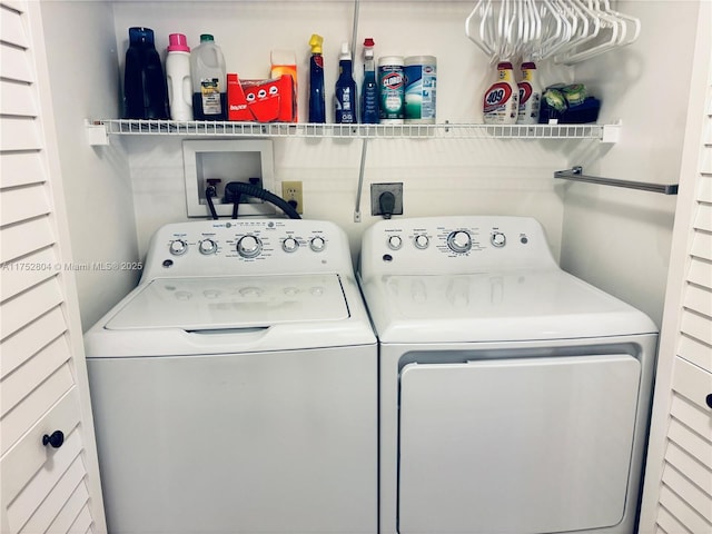 clothes washing area featuring laundry area and washing machine and dryer