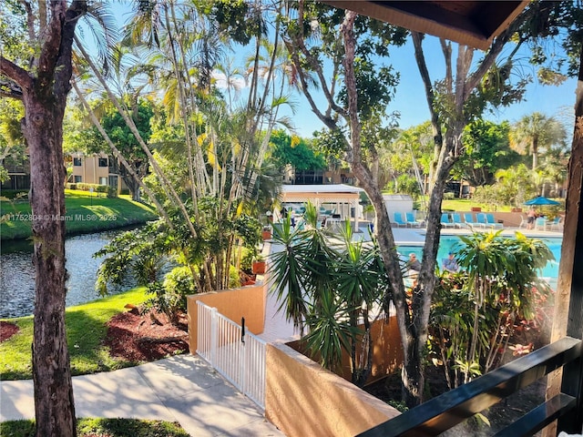 view of patio featuring a water view and a community pool