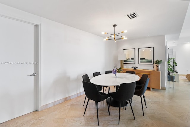 dining area featuring an inviting chandelier, baseboards, light tile patterned floors, and visible vents