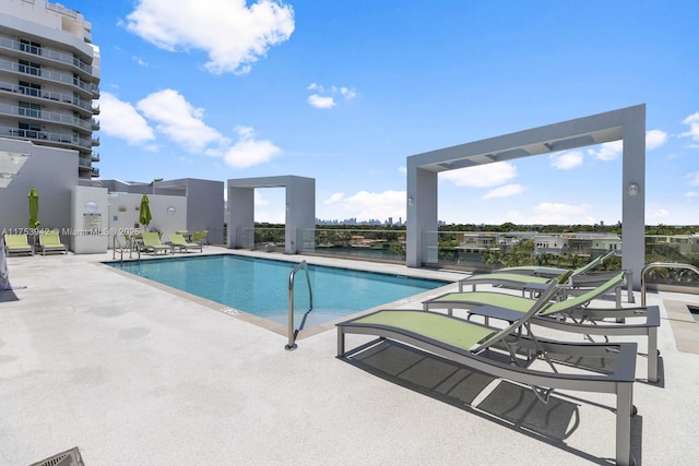 pool featuring a patio area