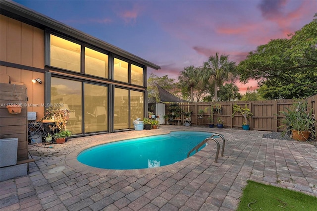 view of pool featuring a fenced in pool, a patio area, and a fenced backyard