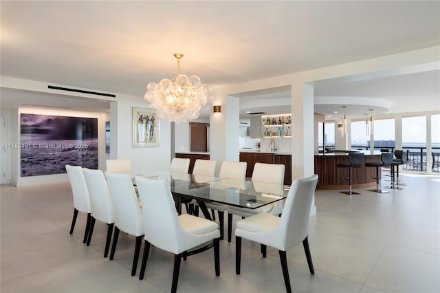 dining room with a barn door and a notable chandelier
