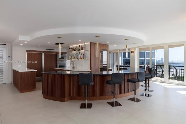 interior space featuring indoor wet bar and a sink