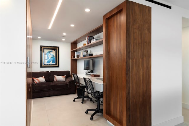 office area featuring built in desk, light tile patterned flooring, and recessed lighting