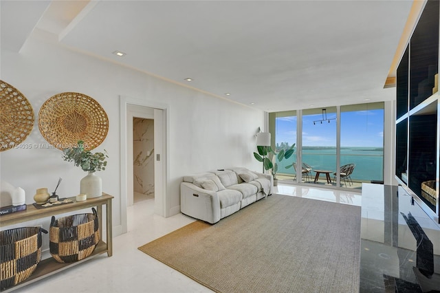 living room with recessed lighting and floor to ceiling windows