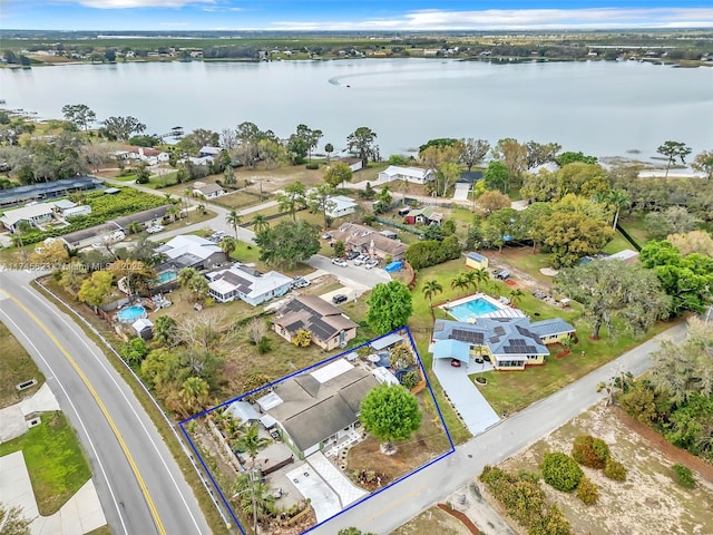 bird's eye view with a water view and a residential view