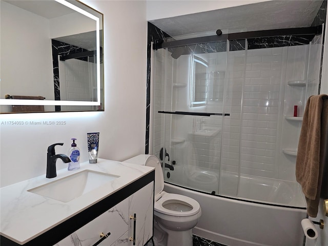 full bath featuring enclosed tub / shower combo, vanity, and toilet