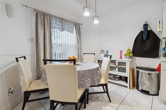 dining space featuring light tile patterned floors