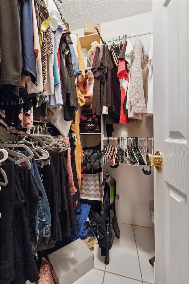 walk in closet featuring tile patterned floors