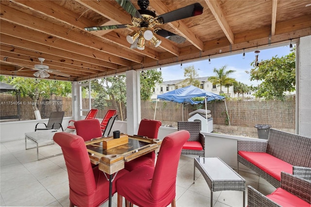 view of patio with a fenced backyard, an outdoor hangout area, and a ceiling fan