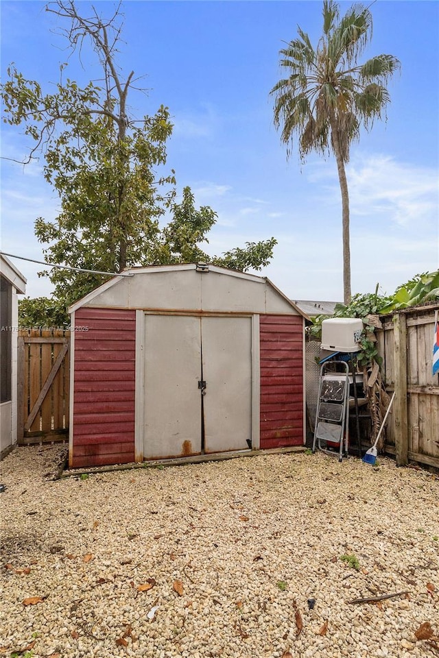 view of shed with fence