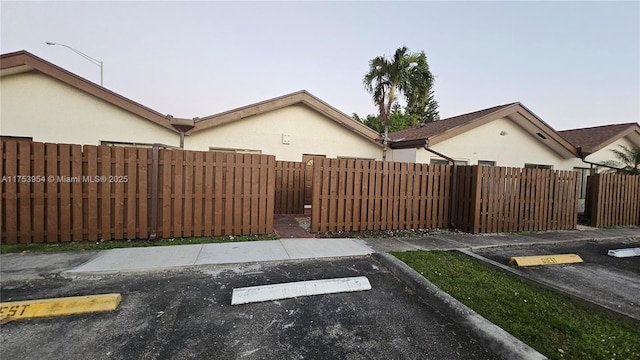 uncovered parking lot with fence