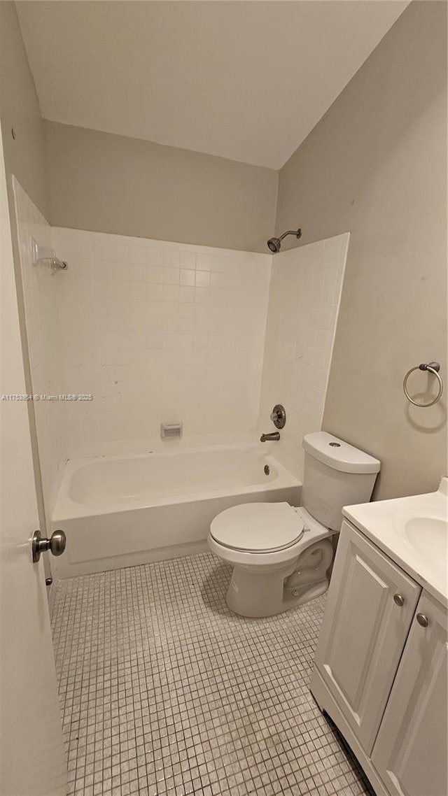 full bathroom with  shower combination, tile patterned flooring, vanity, and toilet